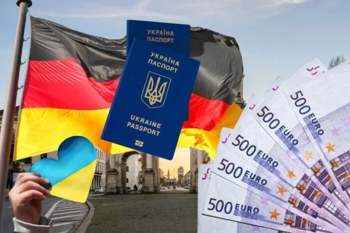 Український паспорт, євро та прапори Німеччини й України біля Бранденбурзьких воріт