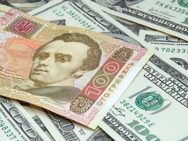 Банкноти 100 гривень та 100 доларів США на тлі курсу НБУ